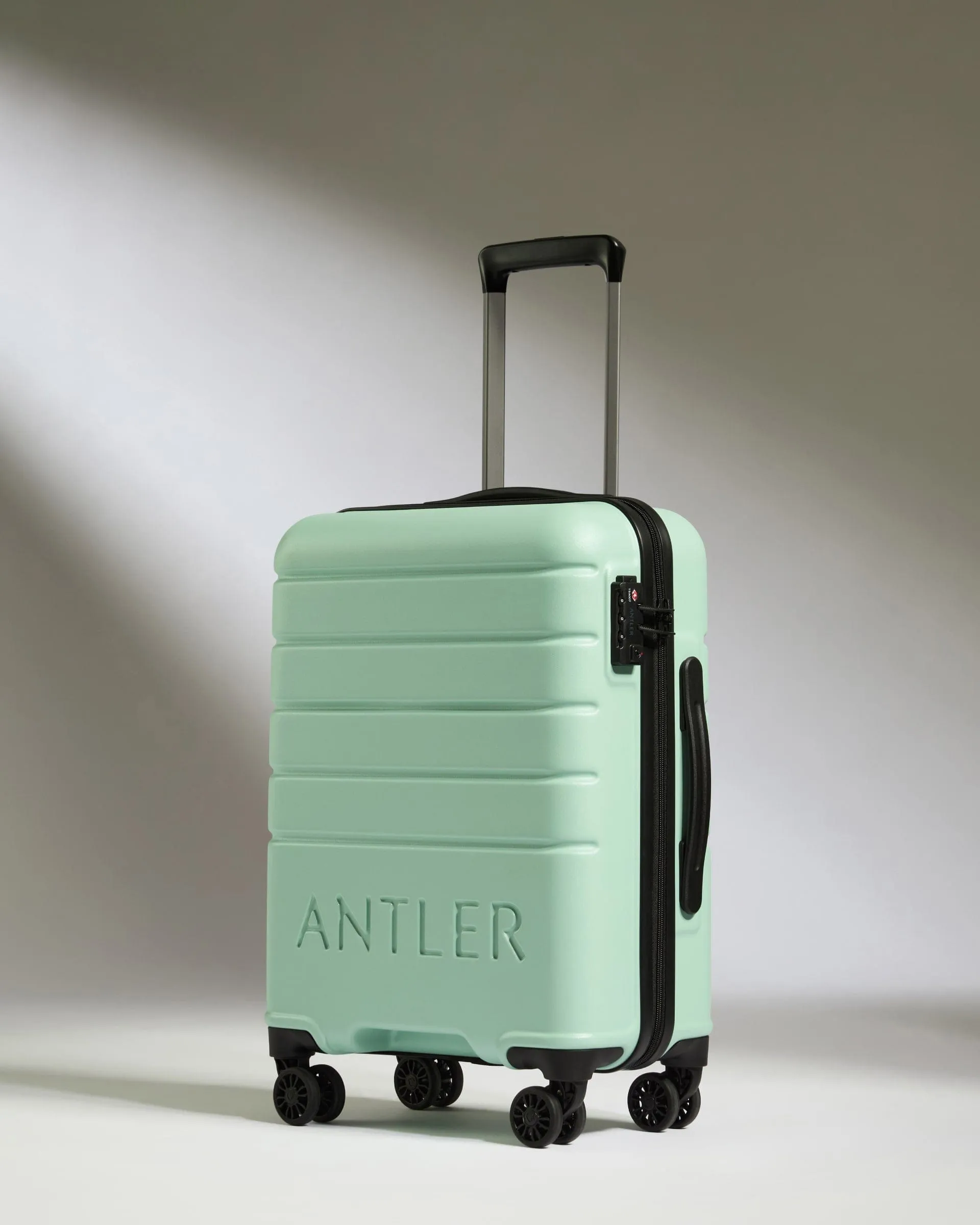 Cabin Suitcase in Aspen Green - Logo